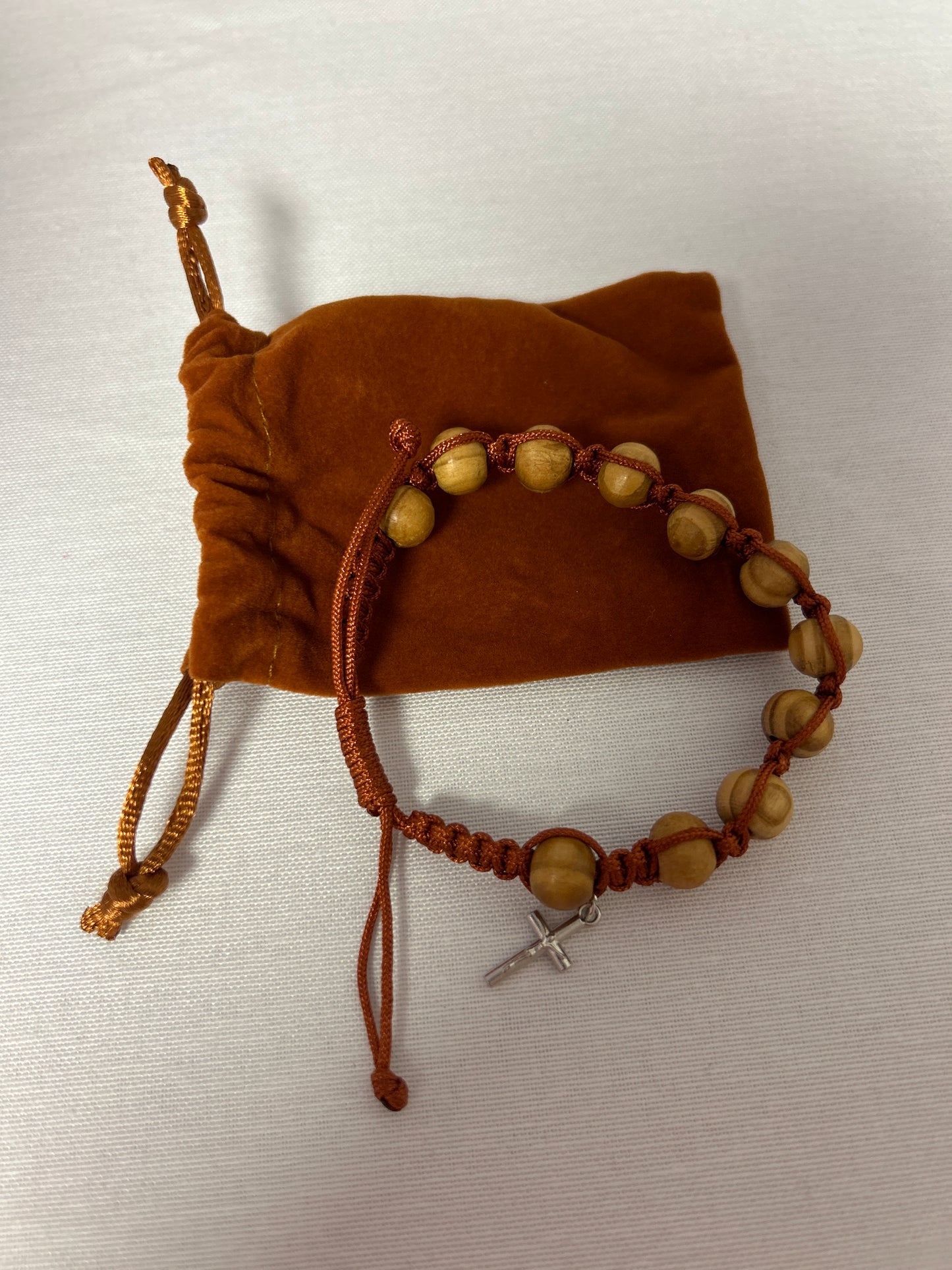 Brown bracelet with cross and wood beads